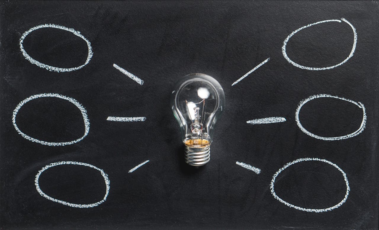 creative A lightbulb on a chalkboard symbolizes creativity, innovation, and ideas.